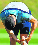 Cristiano Ronaldo checks his knee during a training session in Campinas. Reuters