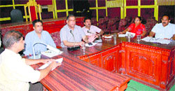 SE PK Goyal and other MC officials conduct the parking lot auction at Town Hall complex in Amritsar on Thursday. PHOTO:RK SONI