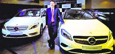 Mercedes-Benz India VP (Sales and Network Development) Boris Fitz poses with Special A-Class and B-Class 'Edition 1' cars in Kolkata on Thursday.