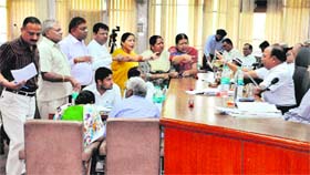 BJP councillors agrue with Mayor Harphool Kalyan (extreme right) during a House meeting of the Muncipal Corporation in Sector 17, Chandigarh, on Thursday.