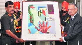 Lt General Philip Campose, GOC-in-C, Western Command, presents a painting to Punjab Governor and UT Administrator Shivraj V Patil during the annual civil and military liaison conference in Chandimandir on Thursday.