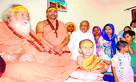 Jagadguru Shankaracharya Swami Swaroopanand blesses Google boy Kautilya Pandit and his parents at his ashram at Kankhal in Haridwar on Thursday.