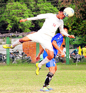 Players in action during a match in the Dehradun District Football League in Dehradun on Thursday.