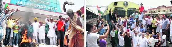 Congress leaders burn an effigy of PM Narendra Modi in protest against rail fare hike; (below) Congress leaders forcibly stop a train at the railway station in Jalandhar on Thursday.