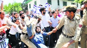 The police detain agitating members of the Jammu and Kashmir General Line Teachers Forum. They were protesting against the recent decision of the government to give service benefits of first five years of their stipendiary service to the Rehbar-e-Taleem (ReT) teachers in Srinagar on Thursday.