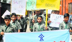 Students carry placards during a rally on International Day against Drug Abuse in Srinagar on Thursday.