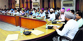 Additional Deputy Commissioner (G) Baldev Singh and Civil Surgeon Dr Subhash Batta address a meeting on preventing smoking in Ludhiana on Thursday.