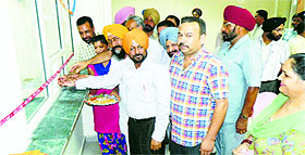 Officials inaugurate the new nodal complaint centre and cash counter at Giaspura in Ludhiana on Thursday.