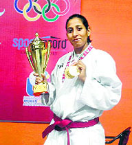 Simi Batta in a jubilant mood after winning two gold medals and a cup at South Asian Karate Championship in New Delhi. 