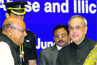 President Pranab Mukherjee being welcomed by Social Justice and Empowerment Minister Thawar Chand Gehlot in New Delhi on Thursday. A Tribune photograph