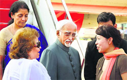 Vice-President Hamid Ansari and his wife Salma Ansari being greeted by Wang Lixia, 