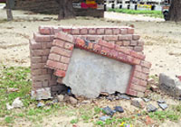 The damaged stone of Martyrs Memorial on Tibbi Sahib Road in Muktsar on Thursday. Tribune photo