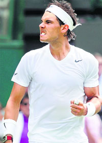 Rafael Nadal reacts after beating Lukas Rosol in the second round of Wimbledon in London on Thursday.