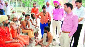 Deputy Commissioner Ravi Bhagat and Red Cross officials visit the Rain Basera complex to monitor arrangements in Amritsar.