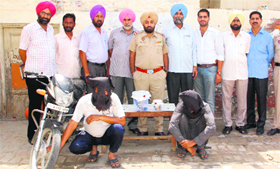 The CIA staff with the two accused in thet heft case.