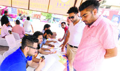 Students getting information from the help desk at Panjab University on Friday. Tribune Photo: Pradeep Tewari