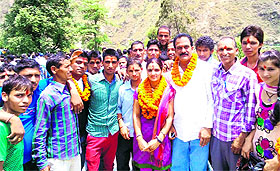 The winning candidates, along with their supporters, at Thatyur in Tehri district on Friday. 