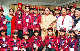 Students from J&K with Finance Minister Indira Hridayesh at the Secretariat in Dehradun on Friday.
