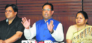 BJP national spokesman Abhimanyu addresses a press conference in Chandigarh on Friday. He is flanked by senior BJP leaders Vishal Seth and Banto Kataria.
