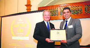 Vishal Anand, founder trustee of Shoolini University, receives the International League Indian Institutes Great Place to Study -2014 Award from British MP Bob Blackman in London.     