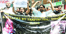 Shia Muslims on Friday hold a protest in Srinagar against the Islamic State of Iraq and Levant for carrying out attacks in Iraq. Tribune photo: Amin War