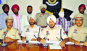 Police officials brief mediapersons in Ludhiana on Friday.