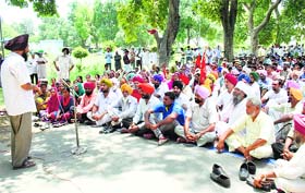 Residents protest the disappearance of youths outside the DCs office in Faridkot on Friday.