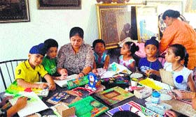 Rubina Singh teaches art to her students during one of the classes