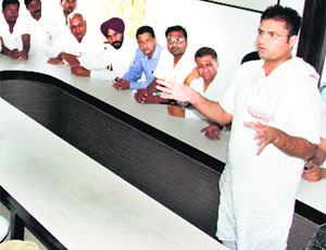 State Congress president Ashok Tanwar addresses party workers at his residence in Sirsa on Saturday.