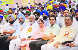 Health and Family Welfare Minister Surjit Kumar Jyani (front row; fourth from right) and Deputy Commissioner Rajat Aggarwal (second from right) attend a state-level function