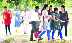 Students come out of an examination centre after appearing in the UGC-NET in Chandigarh on Sunday. Tribune Photo: Pradeep Tewari