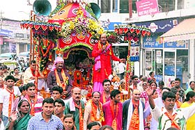 Devotees participate in the Jagannath Rath Yatra in Dehradun on Sunday.