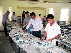Technicians from Hyderabad tests EVMs to be used in the byelections to three Assembly seats at Pithoragarh on Sunday.