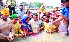 Sai Baba devotees at the Gobind Ghat in Haridwar on Sunday.