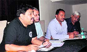 President of Uttarakhand Badminton Association, Ashok Kumar (extreme left) addresses mediapersons in Dehradun on Sunday.