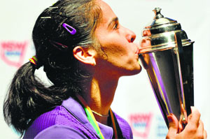 Saina Nehwal with the trophy after beating Carolina Marlin of Spain in the final in Sydney on Sunday