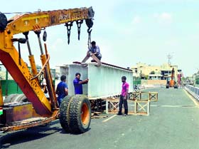 Steel girders being moved to lay the flooring of other side of the railway overbridge connecting Old Sessions Court Chowk and Clock Tower Chowk in Ludhiana on Sunday.