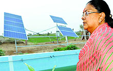 Rajasthan CM Vasundhra Raje takes a look at solar panels installed to run the drip irrigation system in Seruna village