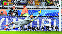 Brazil's Julio Cesar dives as the ball shot by Chile's Gonzalo Jara (unseen) rebounds off the post to decide the penalty shootout on Saturday