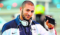 Frances forward Karim Benzema at the Ribeirao Preto airport before boarding a plane on Saturday