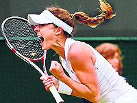 Frances Alize Cornet celebrates after beating Serena in the third round of Wimbledon in London on Saturday