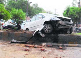 The car, which hit a motorcyclist and landed on the divider, near Rigo Bridge, on the GT Road in Amritsar on Monday