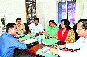 District Magistrate D Senthyl Pendiyan with office-bearers of District Womens Hospital in Haridwar on Monday.