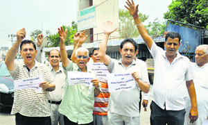 Members of the Tirth Raj Kapal Mochan Shrine and Temples protest in Jammu on Monday.