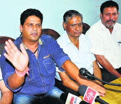 Ravinder Singh, president, J&K poultry Association, addresses mediapersons in Jammu on Monday.