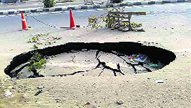 A portion of Chandigarh Road that caved in following the digging work.