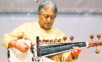 Sarod maestro Ustad Amjad Ali Khan peforms during a concert in Mumbai. 