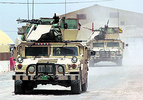 Iraqi security forces ride on vehicles during an intensive security deployment in the town of Jurf al-Sakhar, south of Baghdad, on Monday. 
