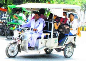 Tourists enjoy a rickshaw ride in Amritsar on Tuesday
