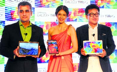 Samsung India managing director (sales) SK Kim (R), Bollywood actor Kalki Koechlin (C) and vice-president (Mobile & IT) Asim Warsi at the launch of Galaxy Tab S in New Delhi on Tuesday.